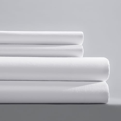 Stack of folded white sheets.