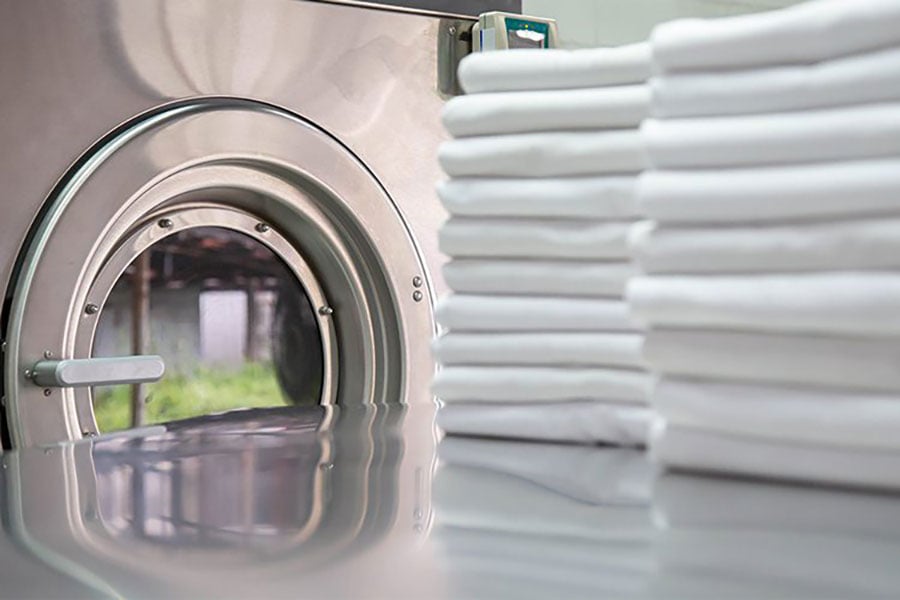 Washing machine and stacks of folded sheets