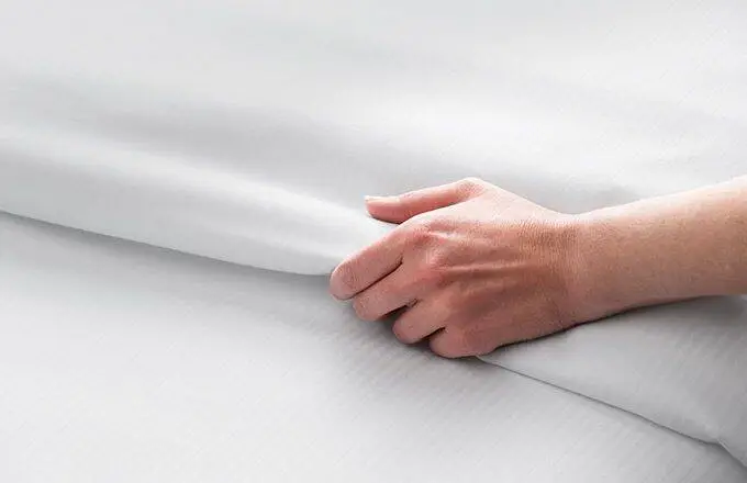 hand on sheet