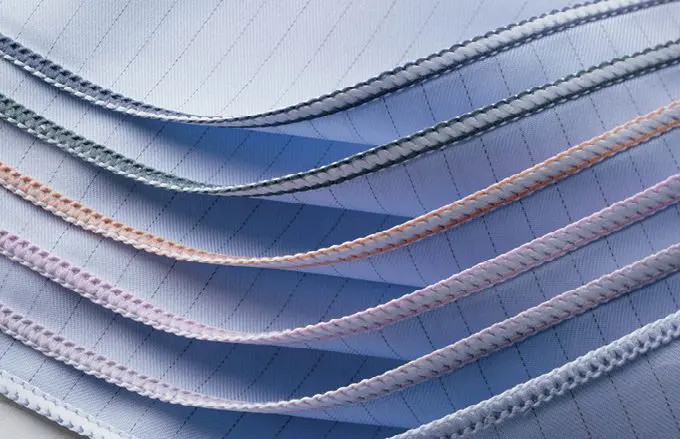 Stack of 6 surgical wrappers with different colored edges to denote dimensions