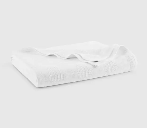 The Elite hospital blanket in white is shown here folded.