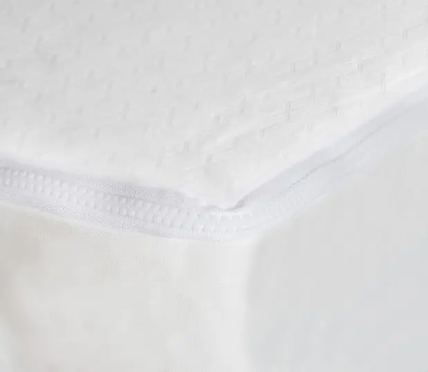 Corner detail of AllerEase Gold Mattress Encasement. This mattress encasement protects against bed bugs, dust mites, allergens, spills, and microbes.