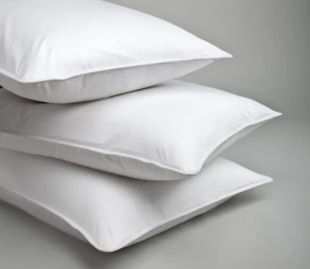 Stack of three Chamber pillows that feature a down alternative pillow filling.