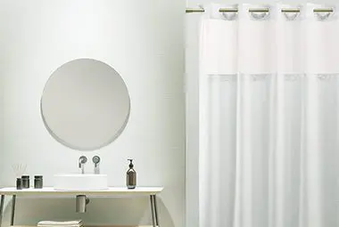 Hook-Free Luxe Waffle shower curtain shown in a bathroom setting.