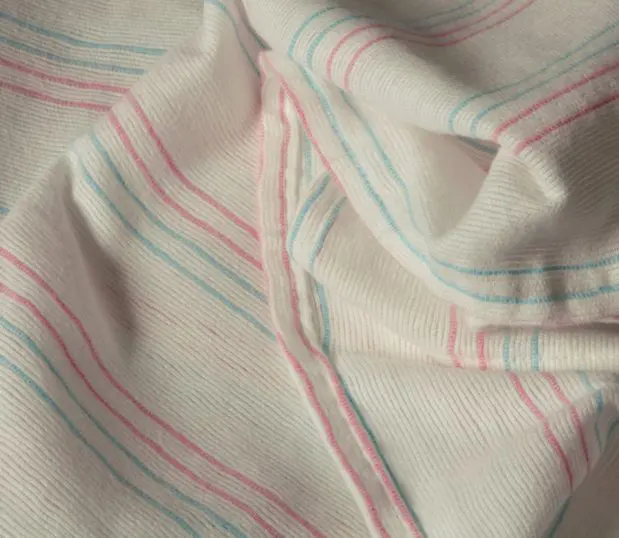 Our PerVal® Receiving Blankets feature the recognizable pink-blue stripes woven for long-lasting vibrance. This image of the baby blanket shows the natural version.