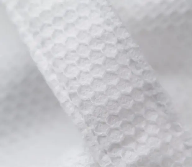 This is a detail of the honeycomb bathrobe. These cotton hotel robes are popular for being light weight and absorbant.