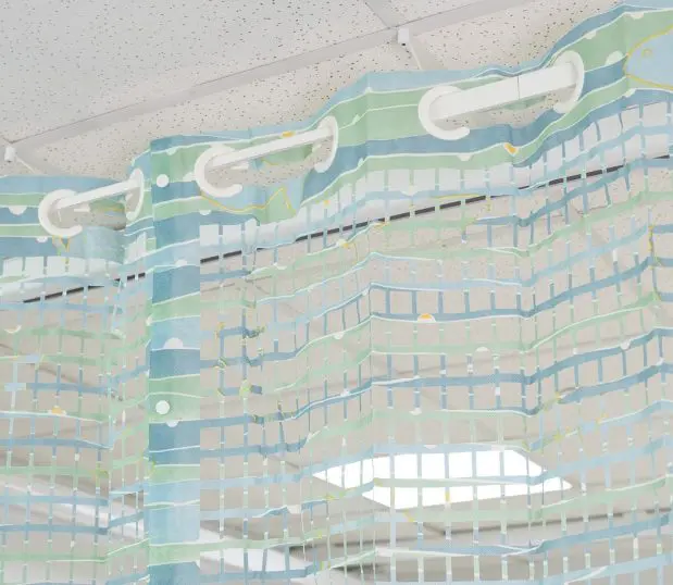 Detail of On the Right Track Disposable Privacy Curtains' integrated mesh. The pattern is called Landscape.
