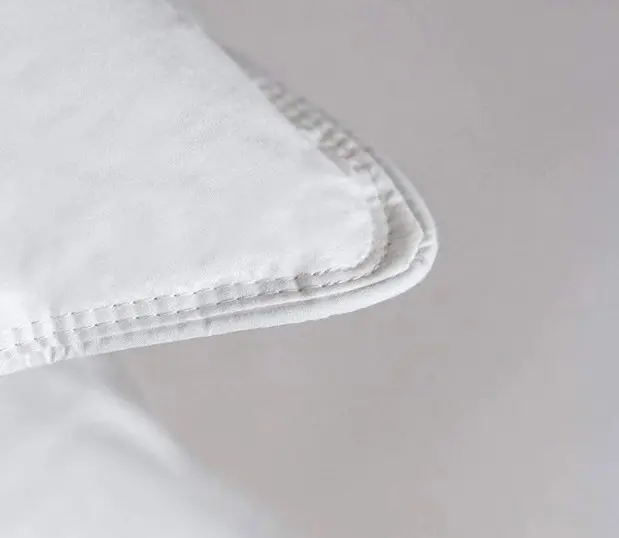 A detailed image of the corner stitch of chamber pillows.