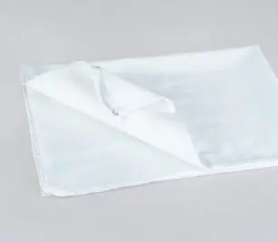 Find affordable, no-frills protection with this no-iron pillow cover. Image shows a folded no-iron pillow cover with an end zipper.