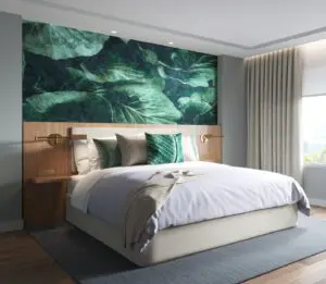 Custom wallcovering of enlargement of green leaves behind bed with coordination ImagePoint pillows.