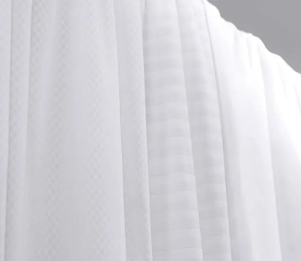 ComforTwill sheets shown in a variety of patterns are shown hanging to spotlight their textures. These durable sheets are made with our pattened Centium Core Technology.