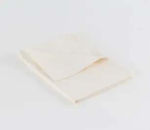 Bone Dyed Percale hospital pillowcase shown folded. Available in King and Standard sizes for hospitals and healthcare systems.