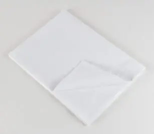 Standard Classic 7030 Woven Sheeting for hospitals and health systems. Available in flat sheet, pillowcase, or drawsheet. Folded flat sheet shown.