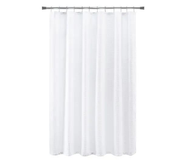Full length silhouette of white shower curtain in the Luxe Waffle pattern.