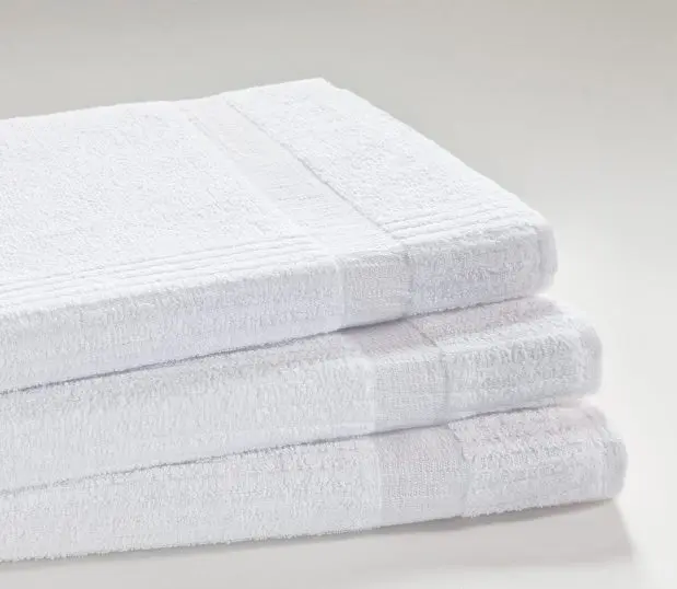 Stack of three Excel Hospital towels showing the ribbed weave sides that strengthens the portion of the towel that typically breaks down.