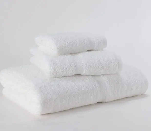 This is an image of the Standard Express towels with a decorative dobby border. Featured in the photo are one each of the bath, hand and wash towels. These bulk towels are designed for the budget conscious property.