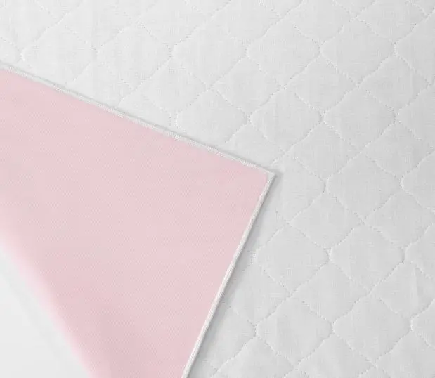 Ibex Underpads are ideal for facilities that experience high volume underpad usage. Shown here: a detail swatch image of the underpad.
