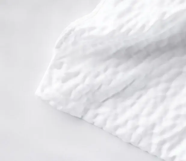 Detail of Cumulus pattern. The Cumulus Duvet is white with a seersucker like pattern.