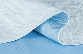 A close up image of a DermaTherapy underpad.