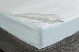 A partially zipped AllerEase Mattress Encasement.