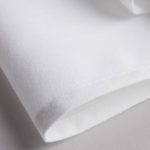 A crisp, folded white Avila napkin