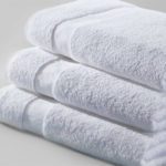A stack of three folded Cam Border Bath Towels.