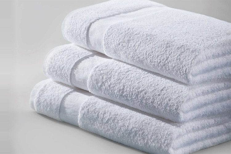 A stack of three folded Cam Border Bath Towels.