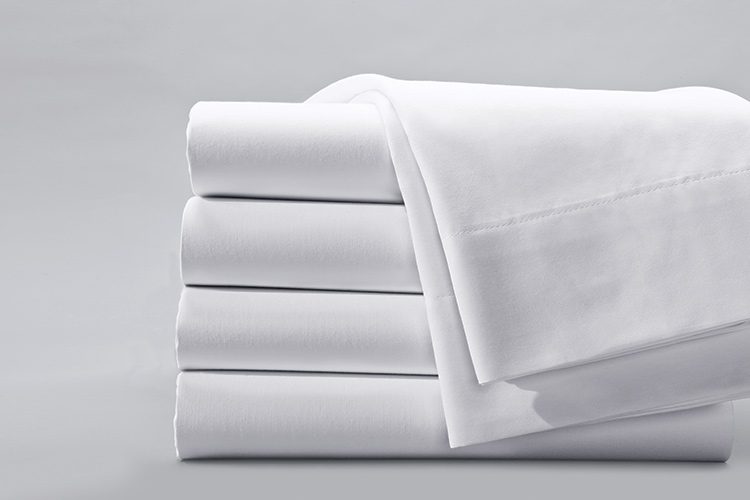 a stack of four centima hospitality sheets