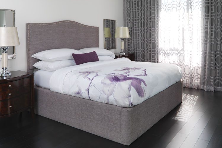 A well made hotel bed featuring a Magnolia colored Circa Modular bed surround.