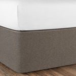 A bed is shown here after the Circa Bed Wrap has been installed. It is a very streamlined modern look.