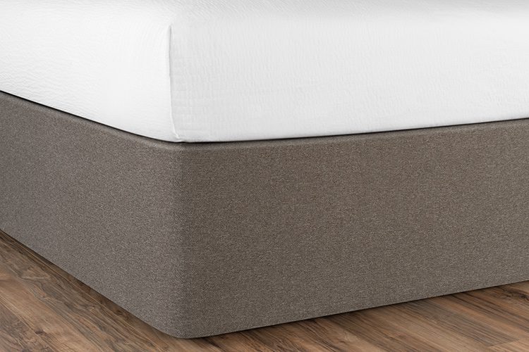 A bed is shown here after the Circa Bed Wrap has been installed. It is a very streamlined modern look.