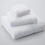 A folded stack of Classic Cam terry, featuring a bath towel, hand towel, and wash cloth.