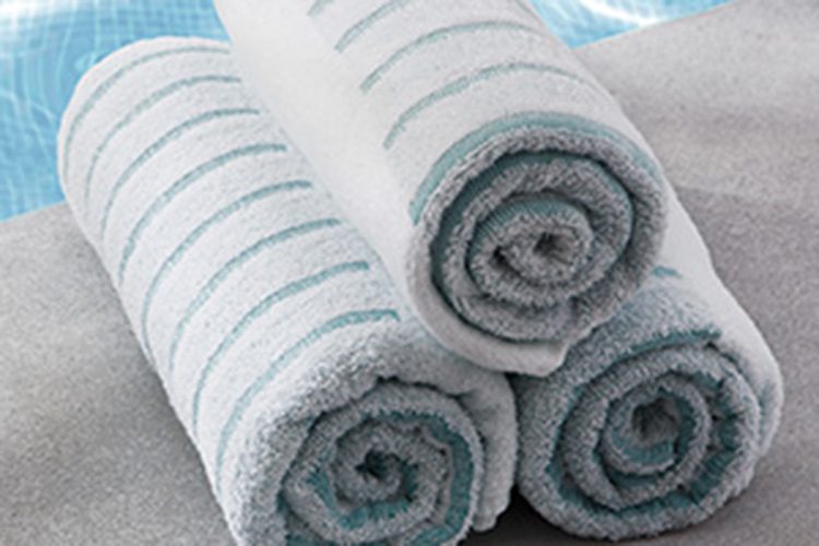 A stack of rolled ColorFill Pool Towels.