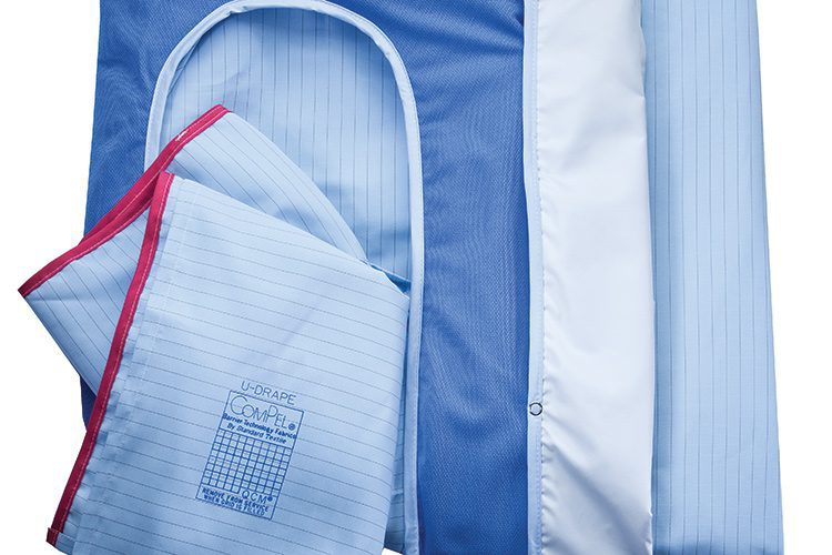 Blue surgical drapes in Compel, a patented continuous-filament synthetic construction that repels liquids even as it allows moisture vapor to pass through.