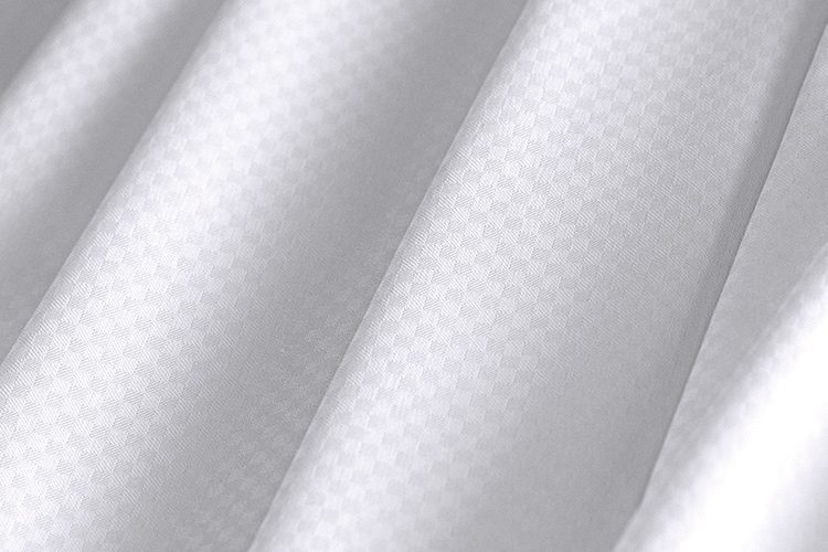 Close up image of ComforTwill hotel sheets in microcheck