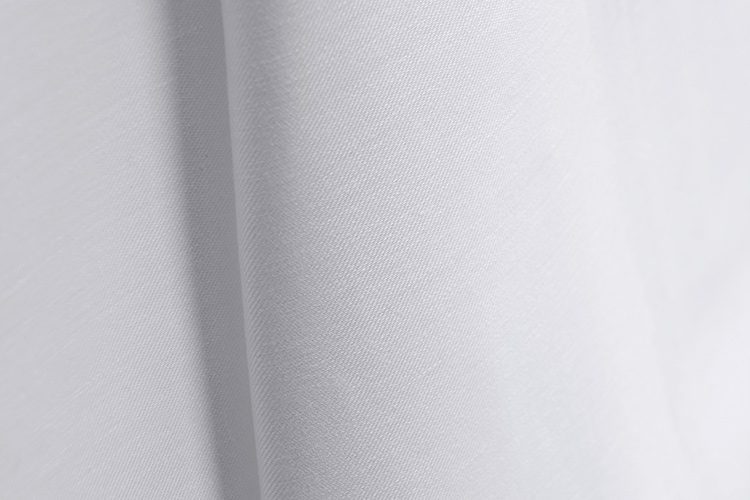 Close up image of ComforTwill hotel sheets in solid