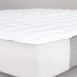 A mattress featuring a Comfort Cloud mattress pad.