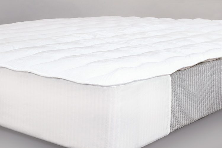 A mattress featuring a Comfort Cloud mattress pad.