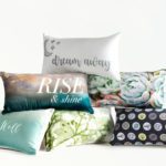 A pile of custom printed decorative throw pillows.