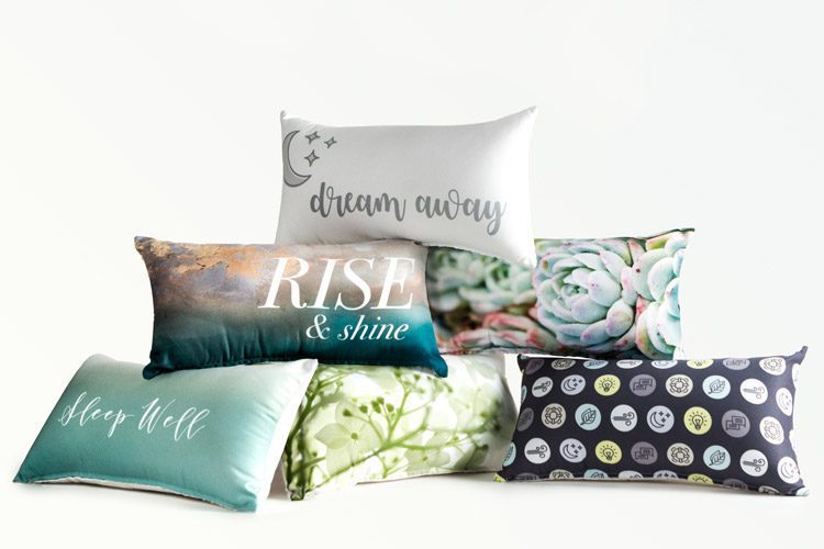A pile of custom printed decorative throw pillows.