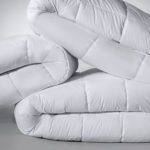 Image of several white Elevations comforters.