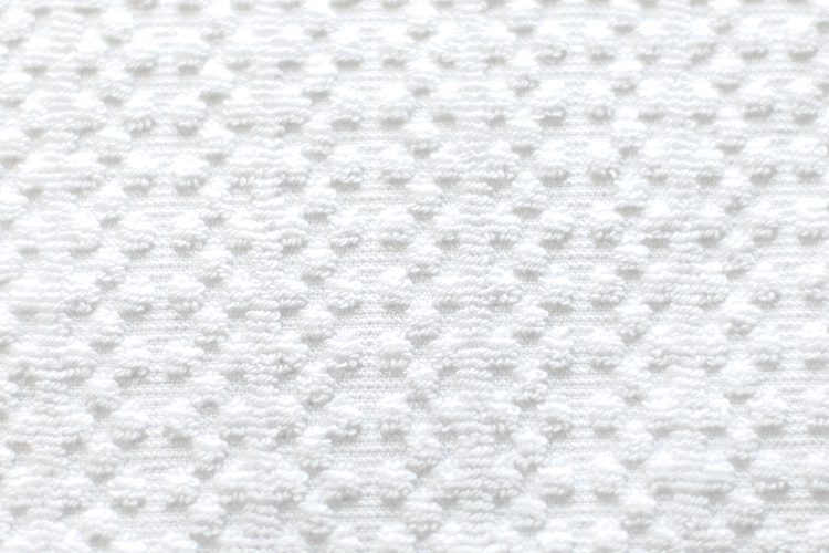 A detail shot of Elevations Bath Towel's Rainfall pattern.