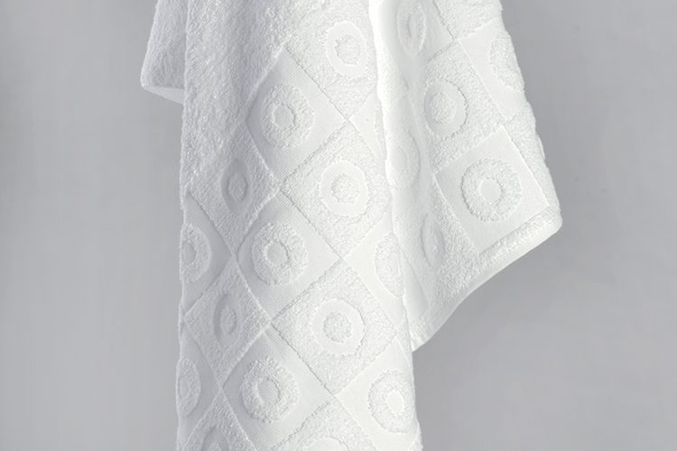 A detail shot of the dobby border of an Elevations bath towel.
