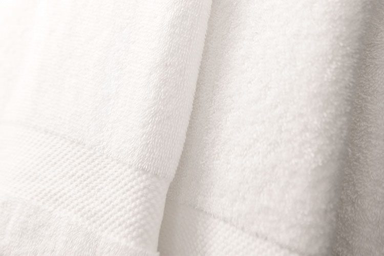 Detail of A stack of EuroClassique hotel bath towels.