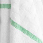 Close-up for Eurospa Lounge Chair bulk pool towel with a green stripe