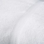 Detail of a white EuroTouch towel for hotels.