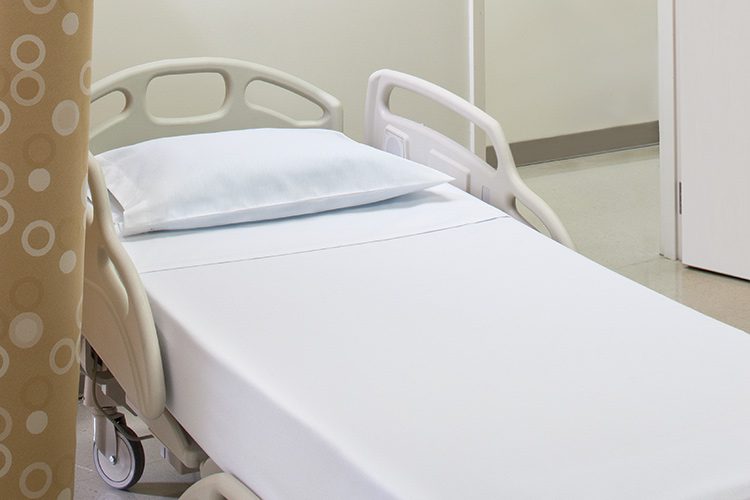 A close cropped image of a healthcare patient bed.