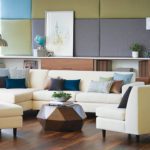 Interior Fabric Collection shown on pillows on an ivory couch and chairs.