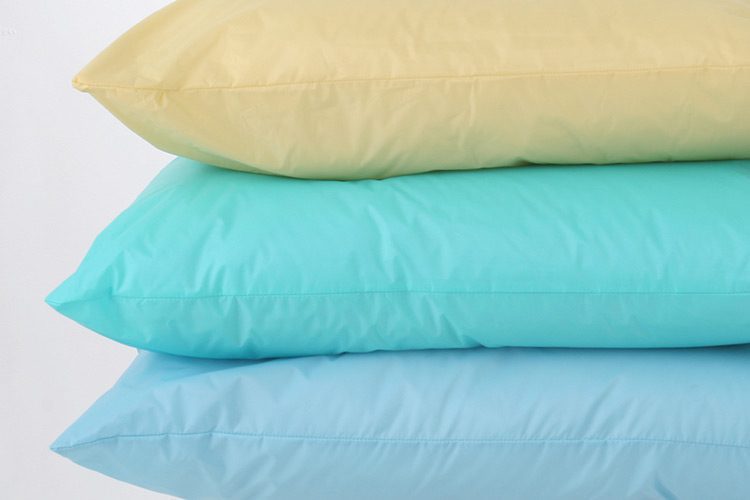 A stack of three healthcare pillows.