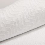 Detail of a herringbone blanket in bleached.
